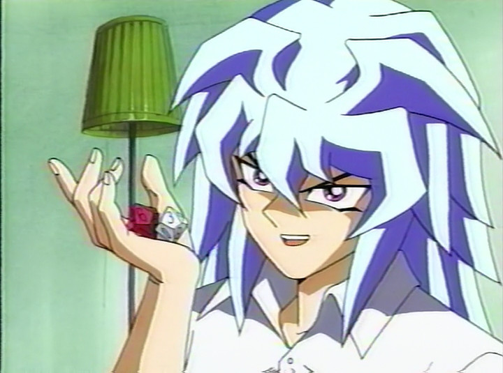 Yami Bakura holding two ten-sided dice in one hand and looking smug.